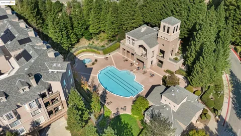 an aerial view of a house with outdoor space and a lake view