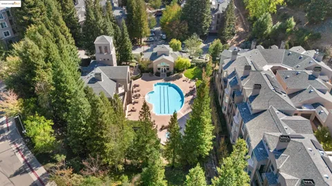an aerial view of a house with a yard and garden