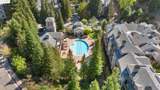 an aerial view of a house with a yard and garden