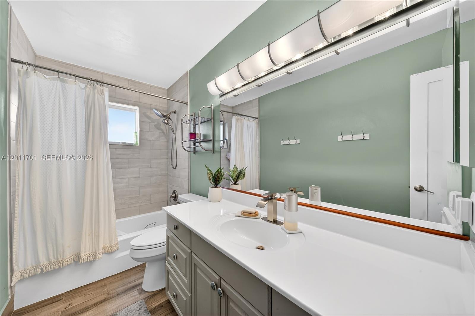 21175 Southwest 232nd Street Miami, FL 33170 - Photo 24 of 66 a bathroom with a sink a toilet and shower