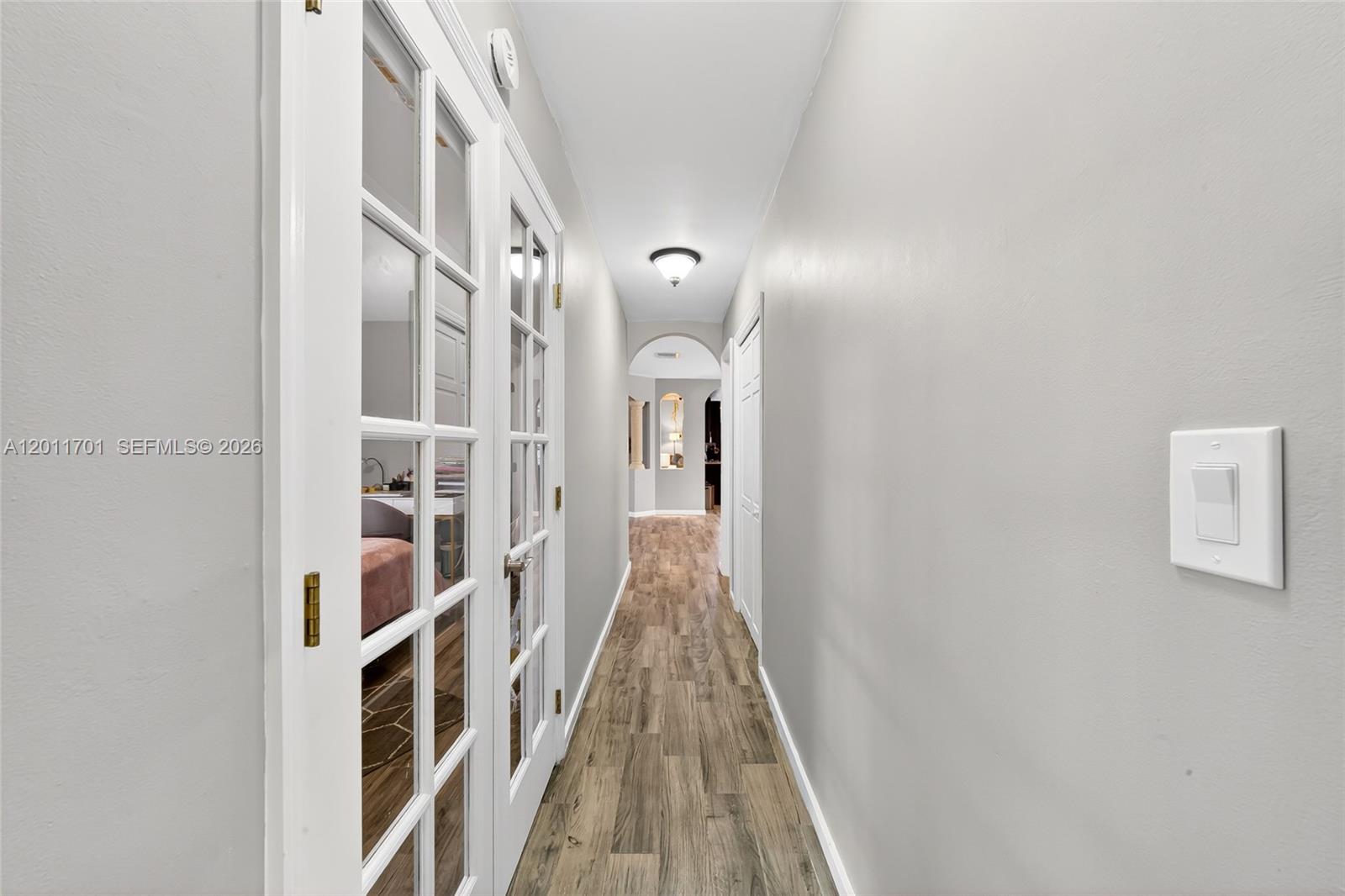 21175 Southwest 232nd Street Miami, FL 33170 - Photo 25 of 66 a view of a hallway with wooden floor and staircase