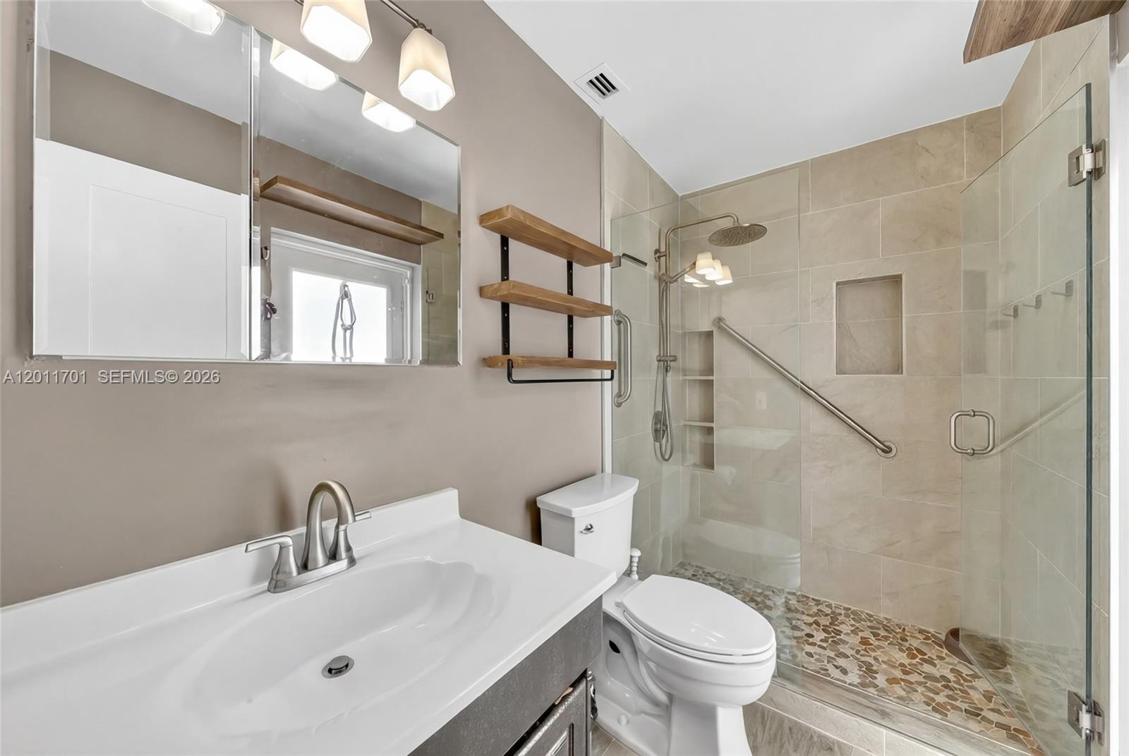 21175 Southwest 232nd Street Miami, FL 33170 - Photo 28 of 66 a bathroom with a sink toilet and shower
