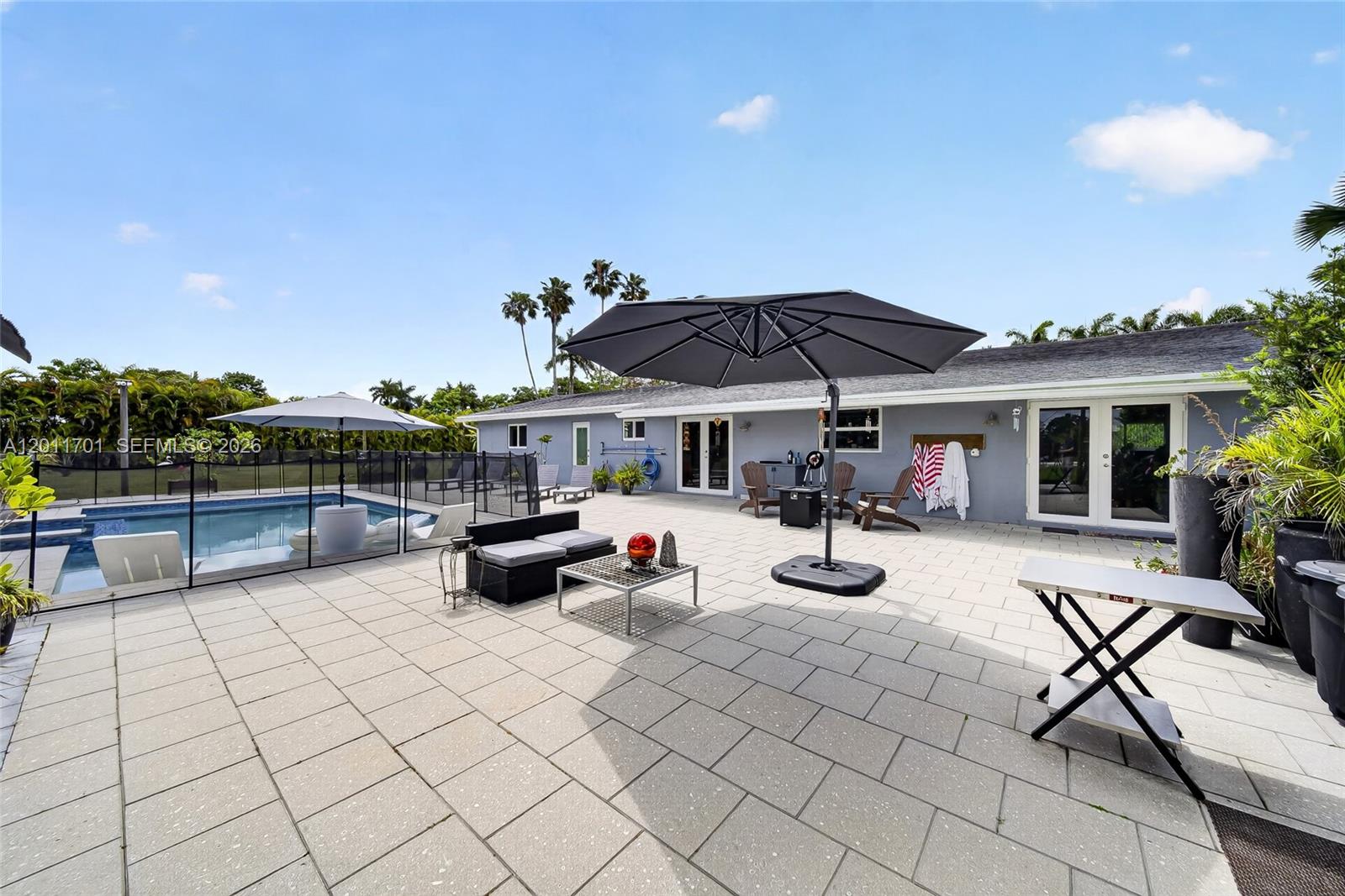 21175 Southwest 232nd Street Miami, FL 33170 - Photo 30 of 66 a view of a patio with chairs and tables