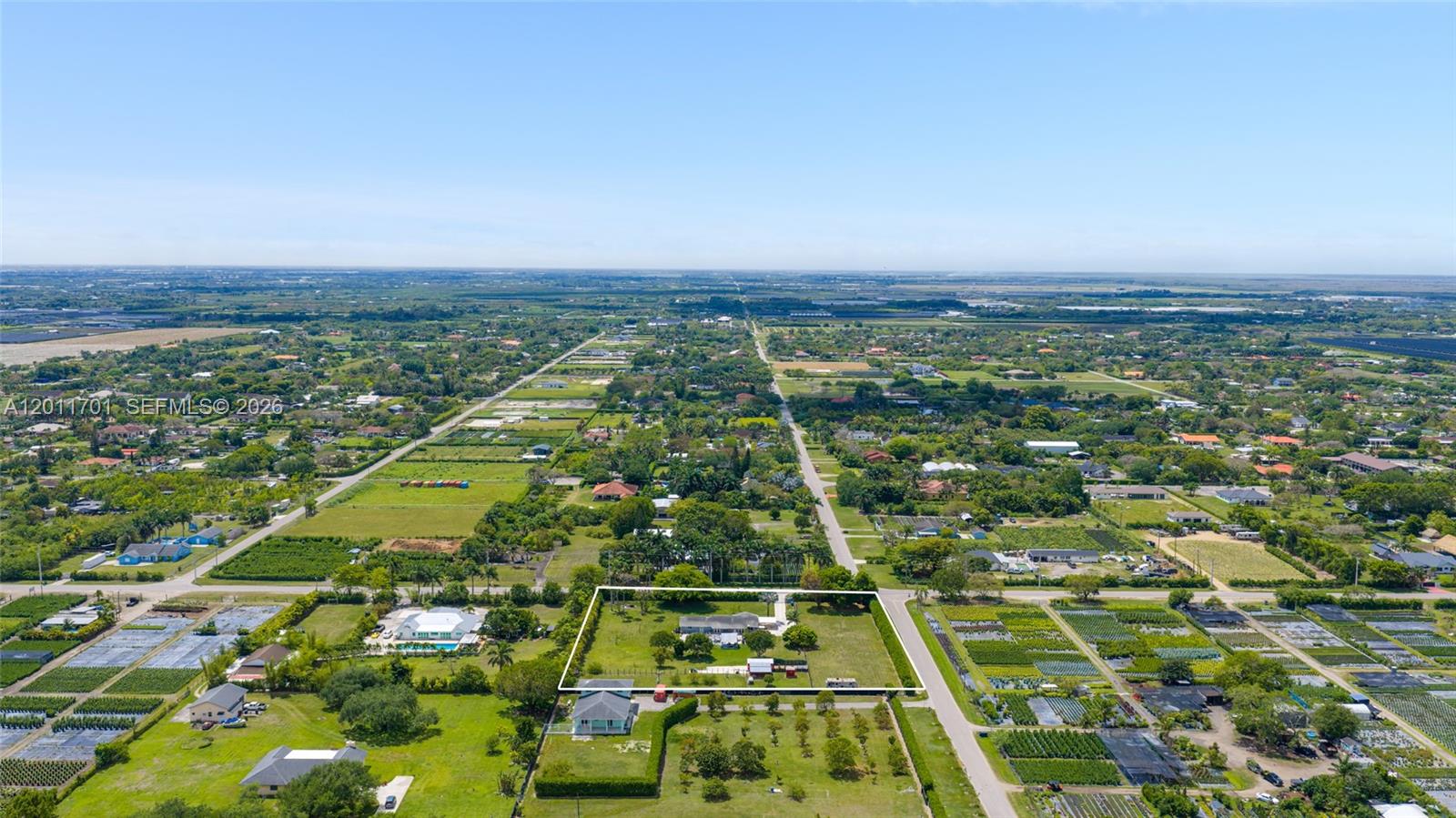 21175 Southwest 232nd Street Miami, FL 33170 - Photo 52 of 66 an aerial view of residential houses with outdoor space
