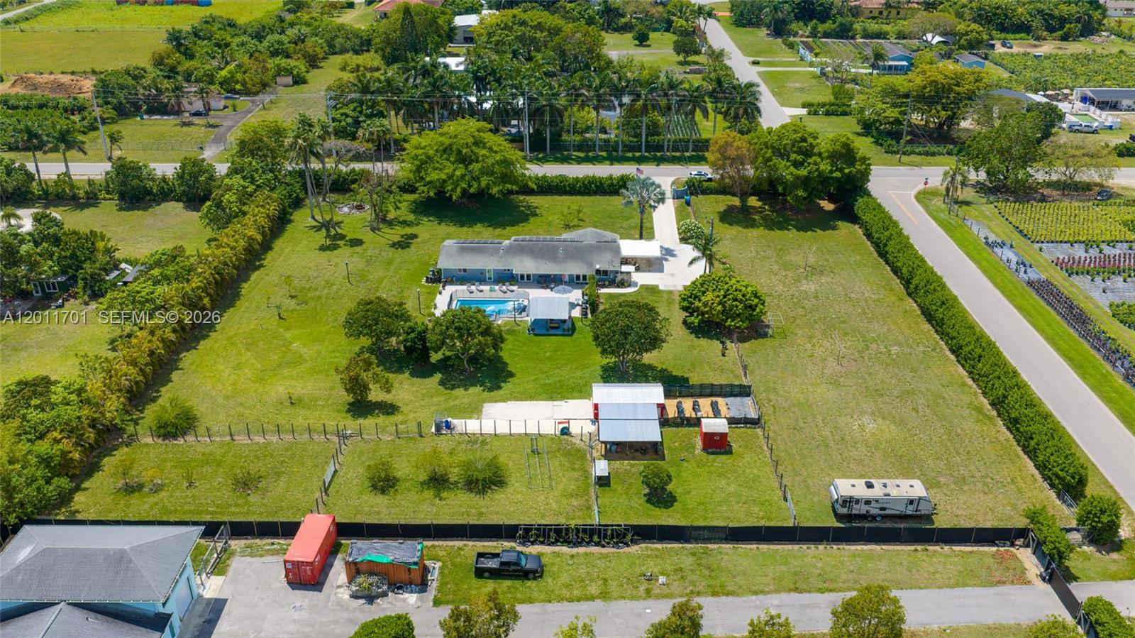 21175 Southwest 232nd Street Miami, FL 33170 - Photo 63 of 66 an aerial view of a house with a garden