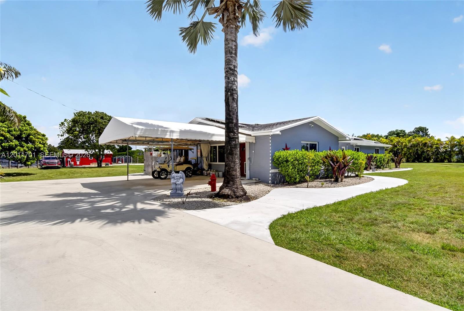 21175 Southwest 232nd Street Miami, FL 33170 - Photo 65 of 66 a view of a park with plants and palm tree