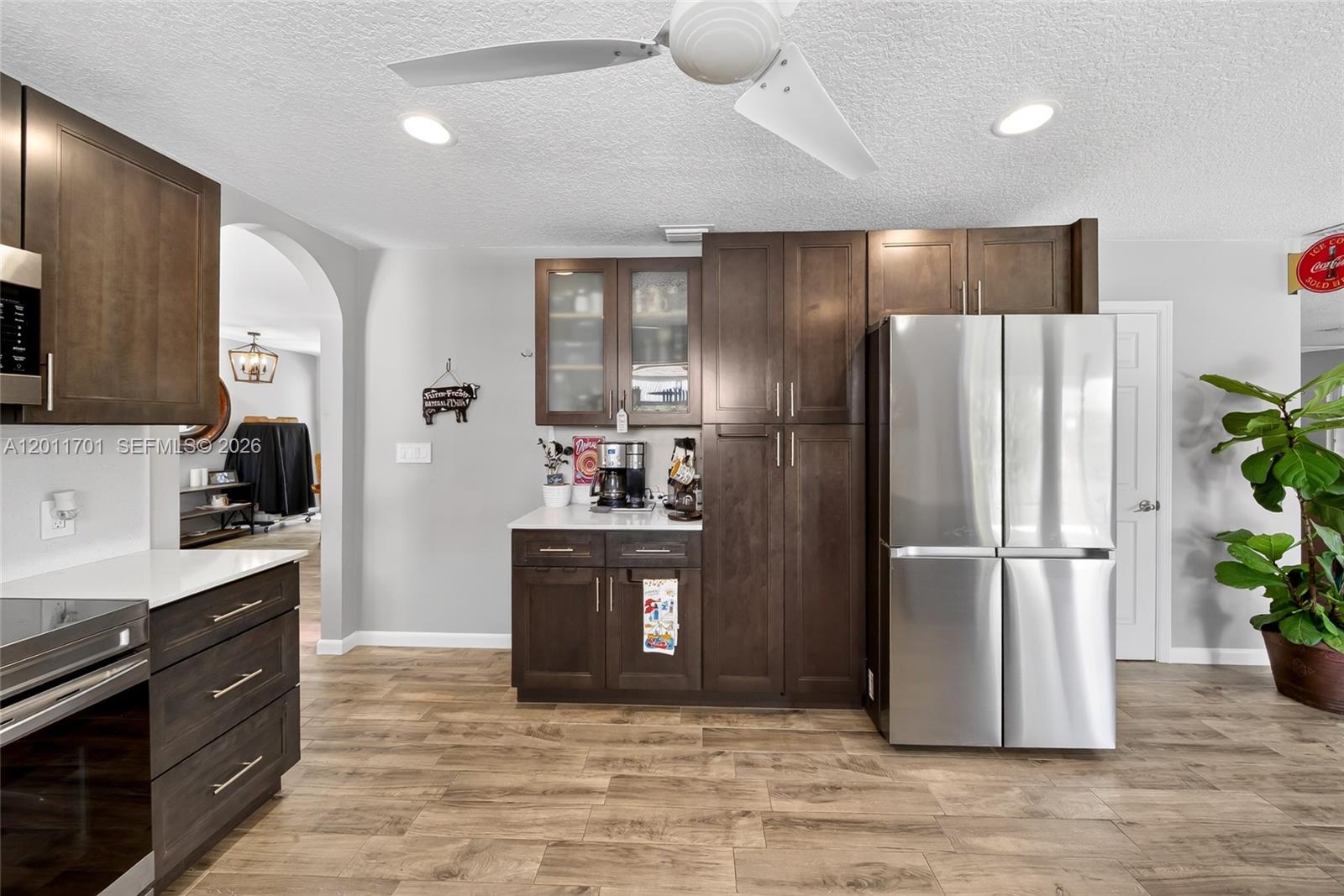21175 Southwest 232nd Street Miami, FL 33170 - Photo 10 of 66 a kitchen with stainless steel appliances granite countertop a refrigerator and a stove