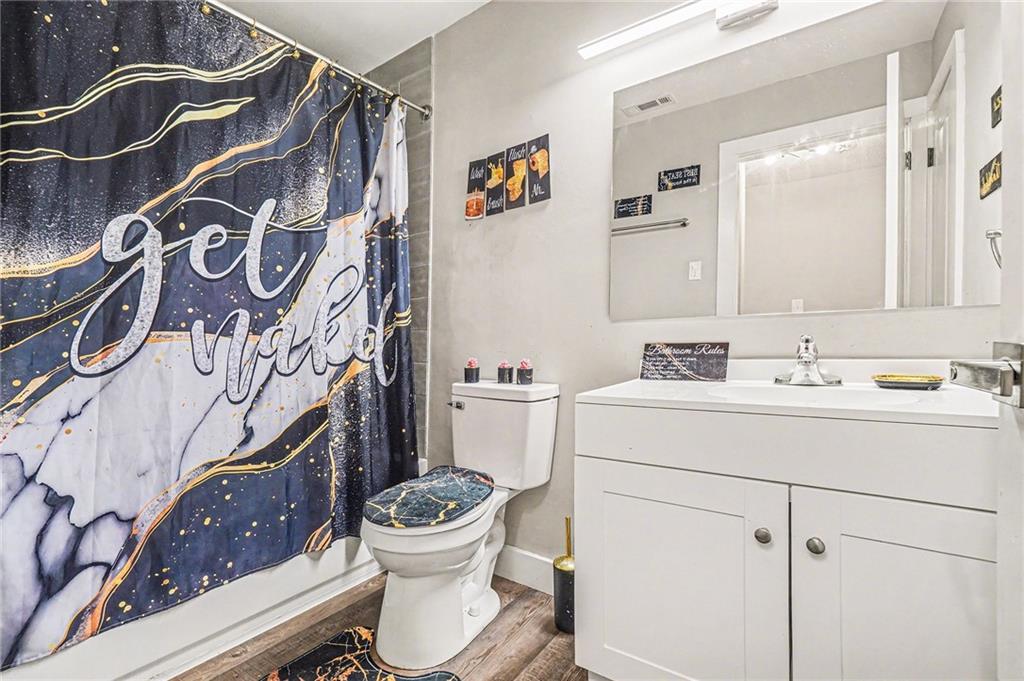405 Fairburn Road Southwest, Unit 231 Atlanta, GA 30331 - Photo 14 of 16 a bathroom with a sink toilet and shower