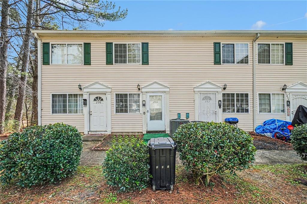 405 Fairburn Road Southwest, Unit 231 Atlanta, GA 30331 - Photo 2 of 16 front view of a house with a yard