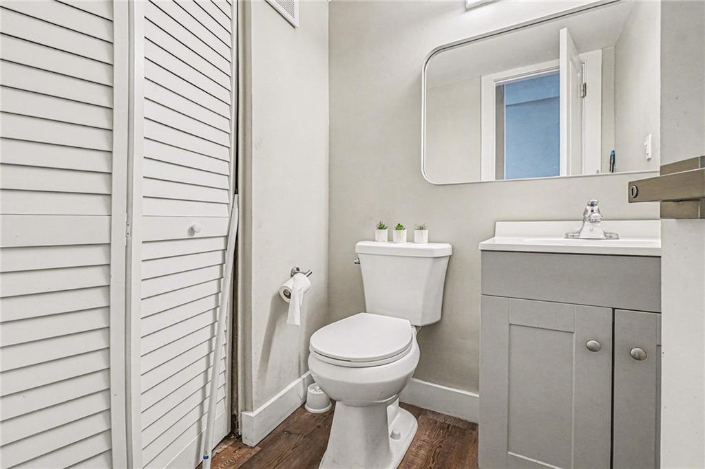 405 Fairburn Road Southwest, Unit 231 Atlanta, GA 30331 - Photo 8 of 16 a bathroom with a toilet a sink and mirror