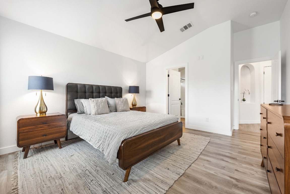 3309 Wickham Lane Austin, TX 78725 - Photo 11 of 24 a spacious bedroom with a bed and a dresser