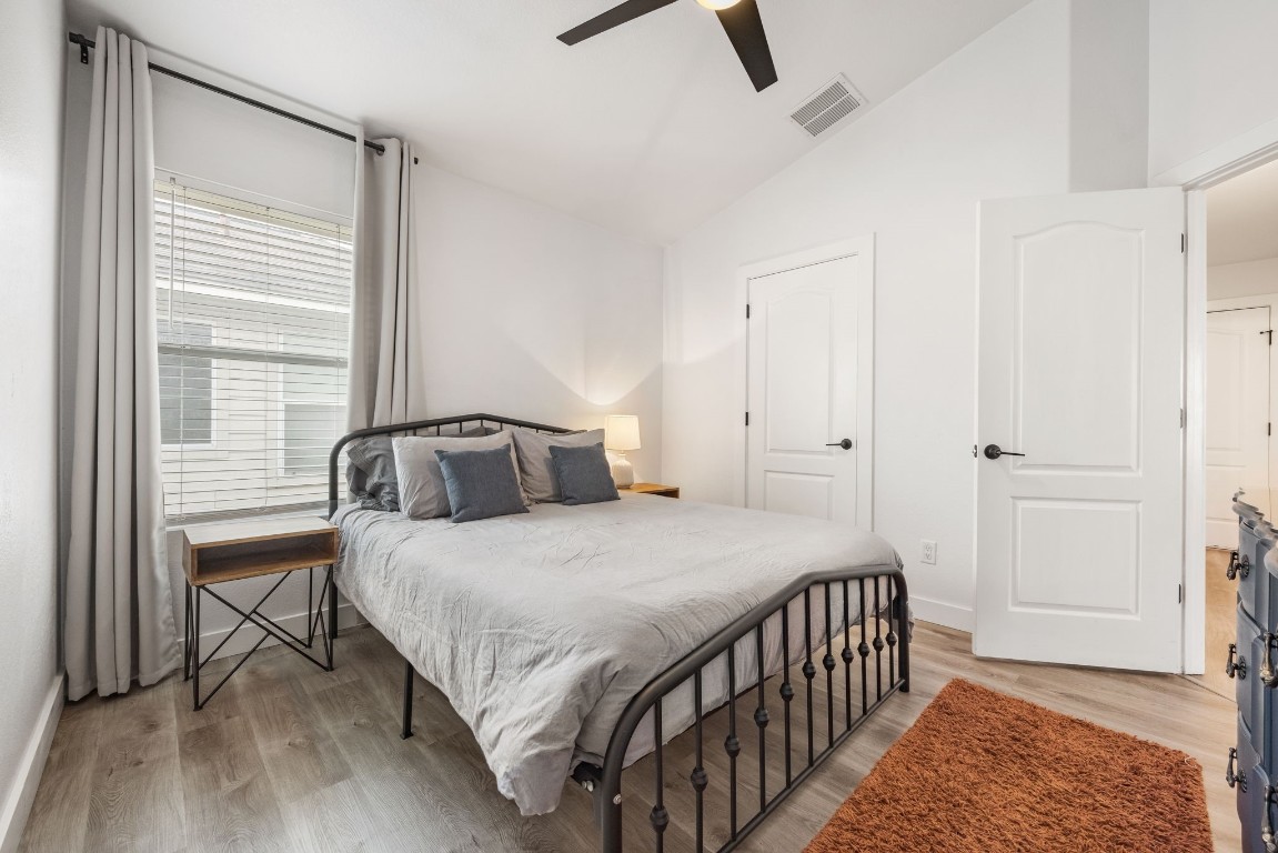 3309 Wickham Lane Austin, TX 78725 - Photo 14 of 24 a bedroom with a bed and a window