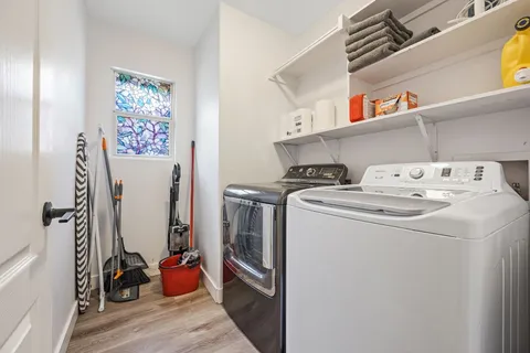 a utility room with dryer and washer