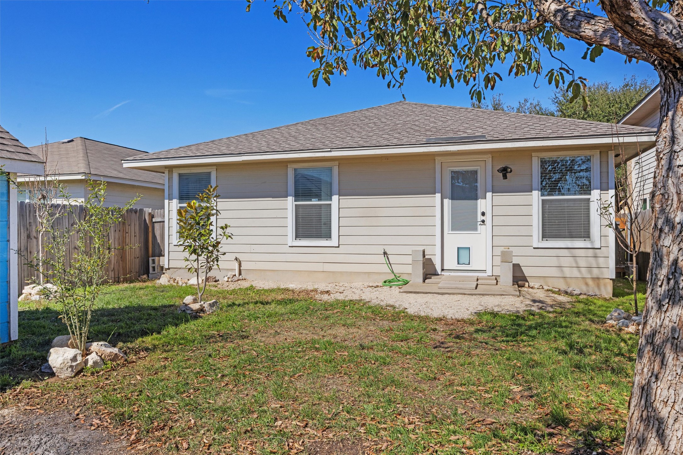 3309 Wickham Lane Austin, TX 78725 - Photo 18 of 24 front view of a house with a yard