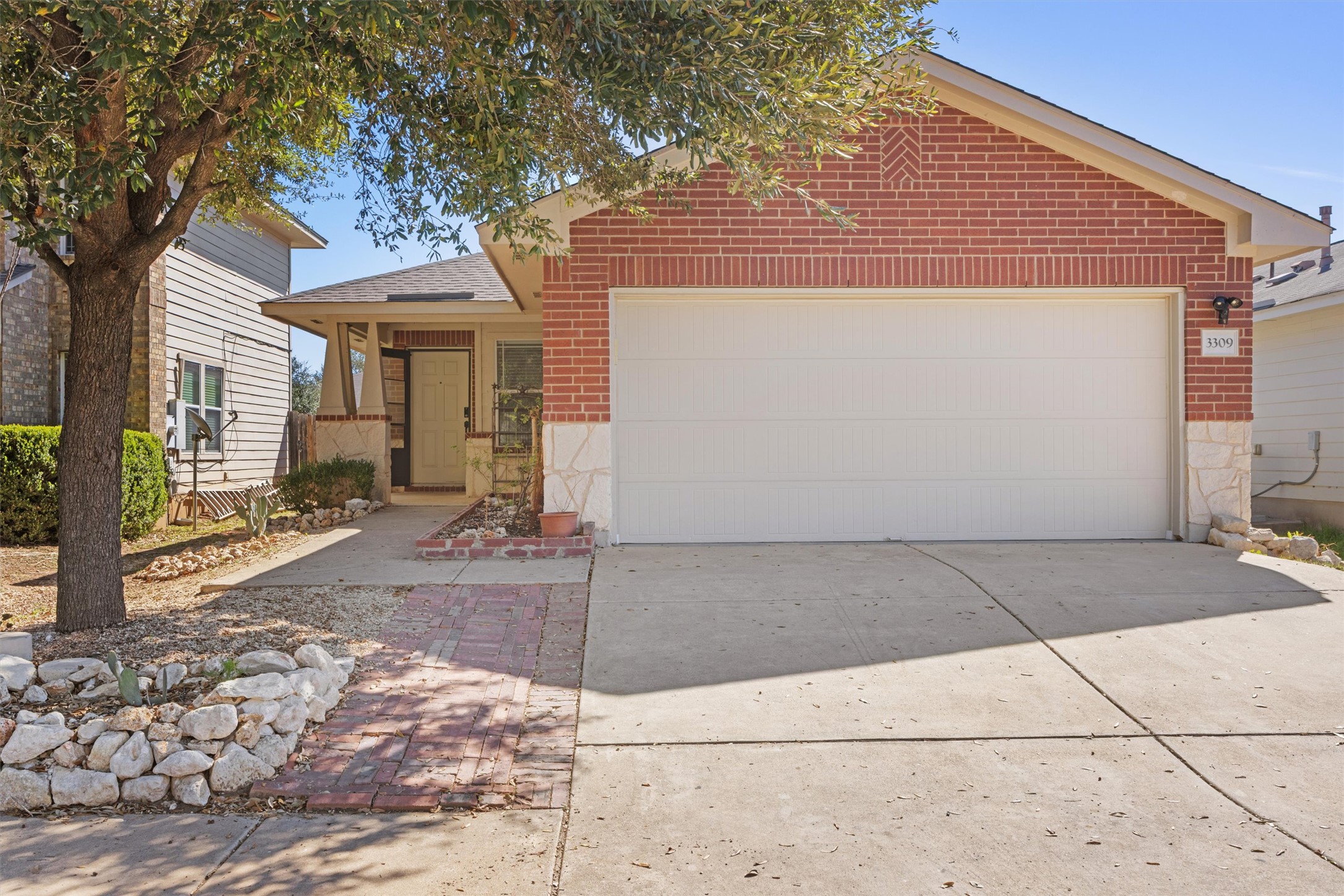 3309 Wickham Lane Austin, TX 78725 - Photo 2 of 24 a front view of a house