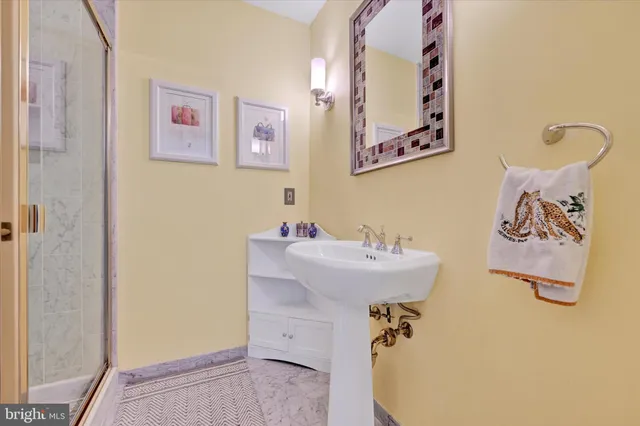 a bathroom with a sink and mirror