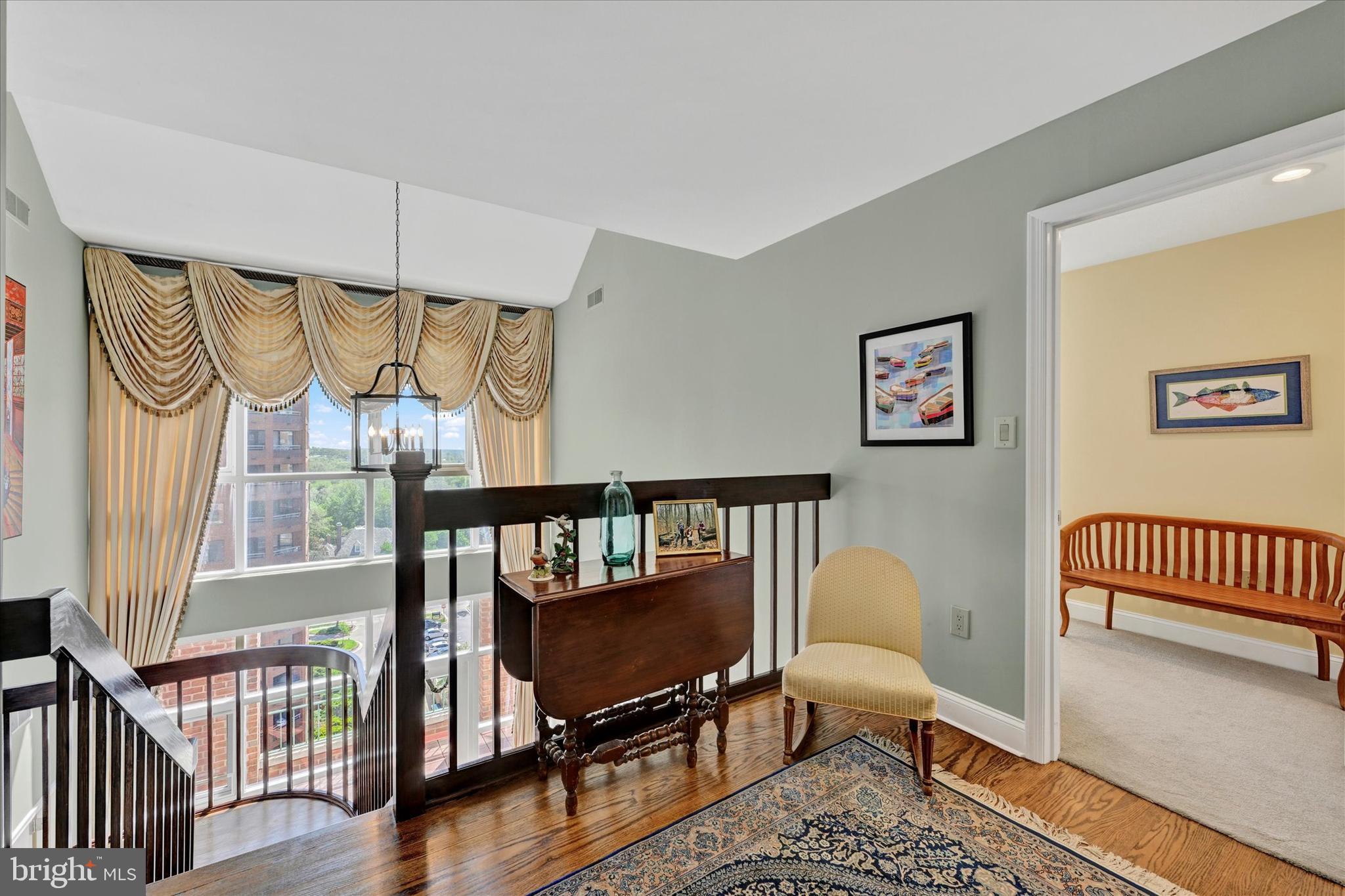 3801 Canterbury Road, Unit 1002 Baltimore, MD 21218 - Photo 17 of 32 a bedroom with furniture and a window