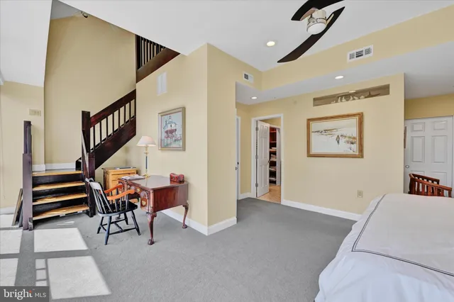 a view of a livingroom with furniture and stairs