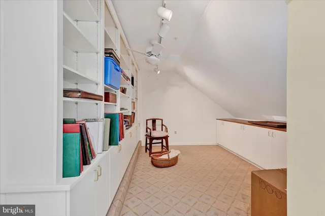 a view of a hallway with seating area