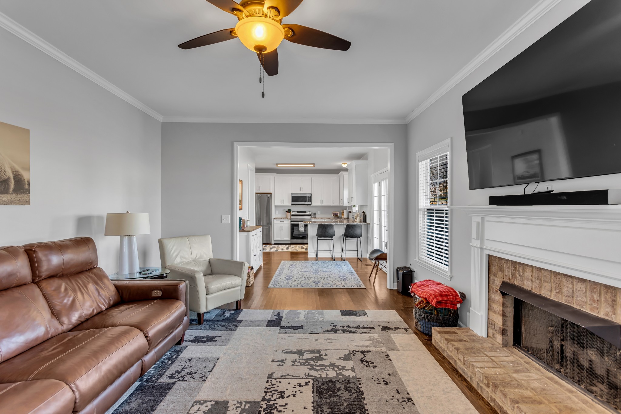 7009 Masonboro Drive Spring Hill, TN 37174 - Photo 16 of 40 a living room with furniture and a fireplace