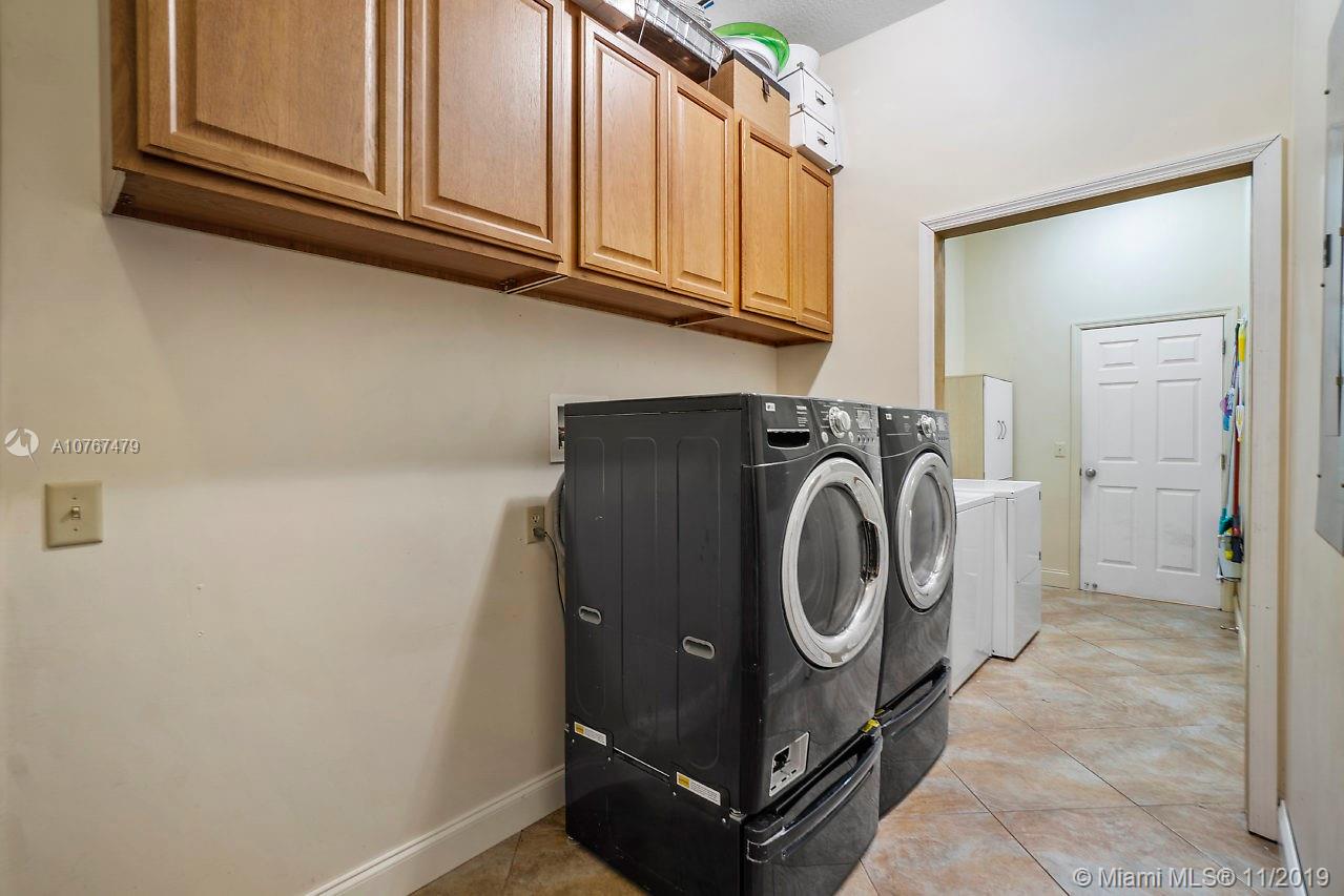 6915 Southwest 185th Way Southwest Ranches, FL 33332 - Photo 20 of 48 a utility room with dryer and washer