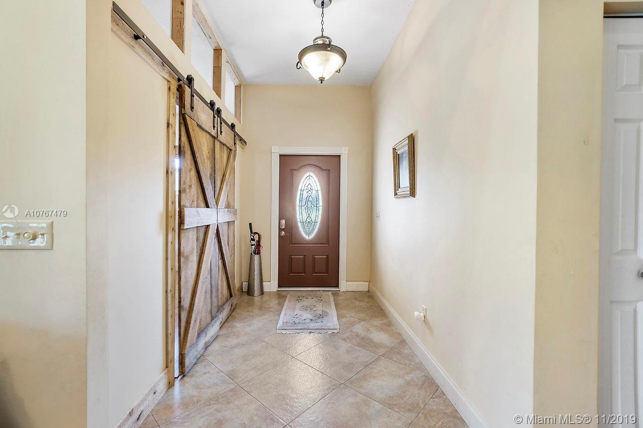 6915 Southwest 185th Way Southwest Ranches, FL 33332 - Photo 22 of 48 a view of a hallway with a elevator