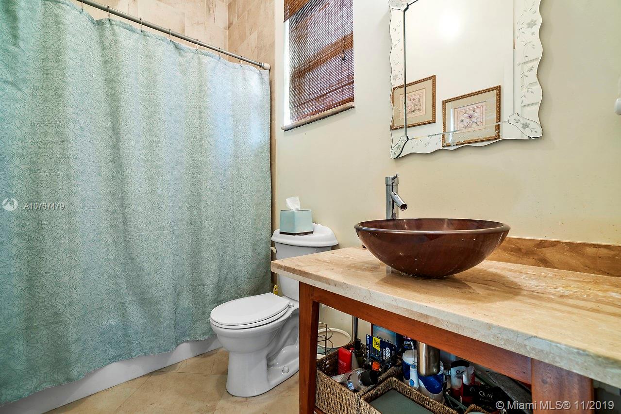 6915 Southwest 185th Way Southwest Ranches, FL 33332 - Photo 29 of 48 a room with a table and a potted plant