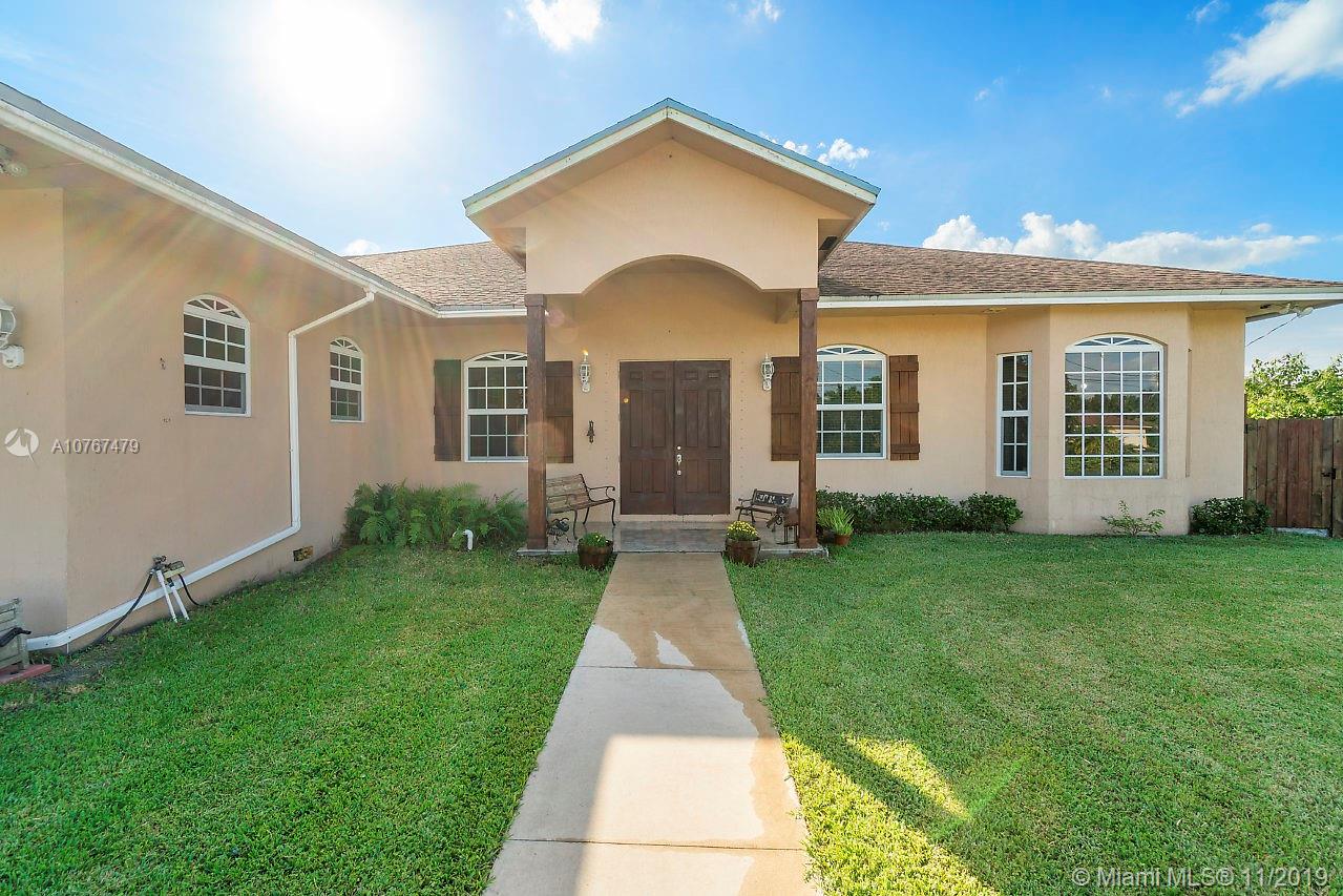 6915 Southwest 185th Way Southwest Ranches, FL 33332 - Photo 35 of 48 front view of a house with a yard