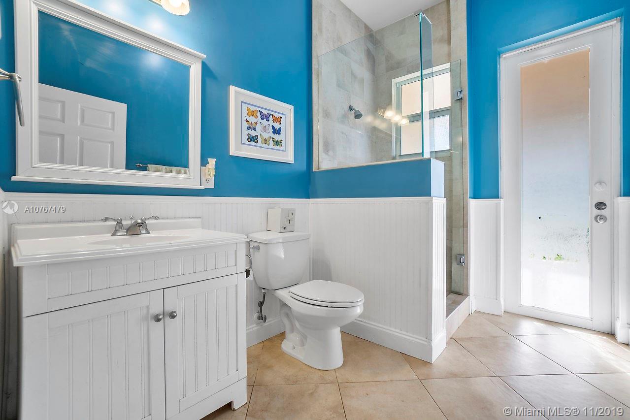6915 Southwest 185th Way Southwest Ranches, FL 33332 - Photo 9 of 48 a bathroom with a sink toilet and shower