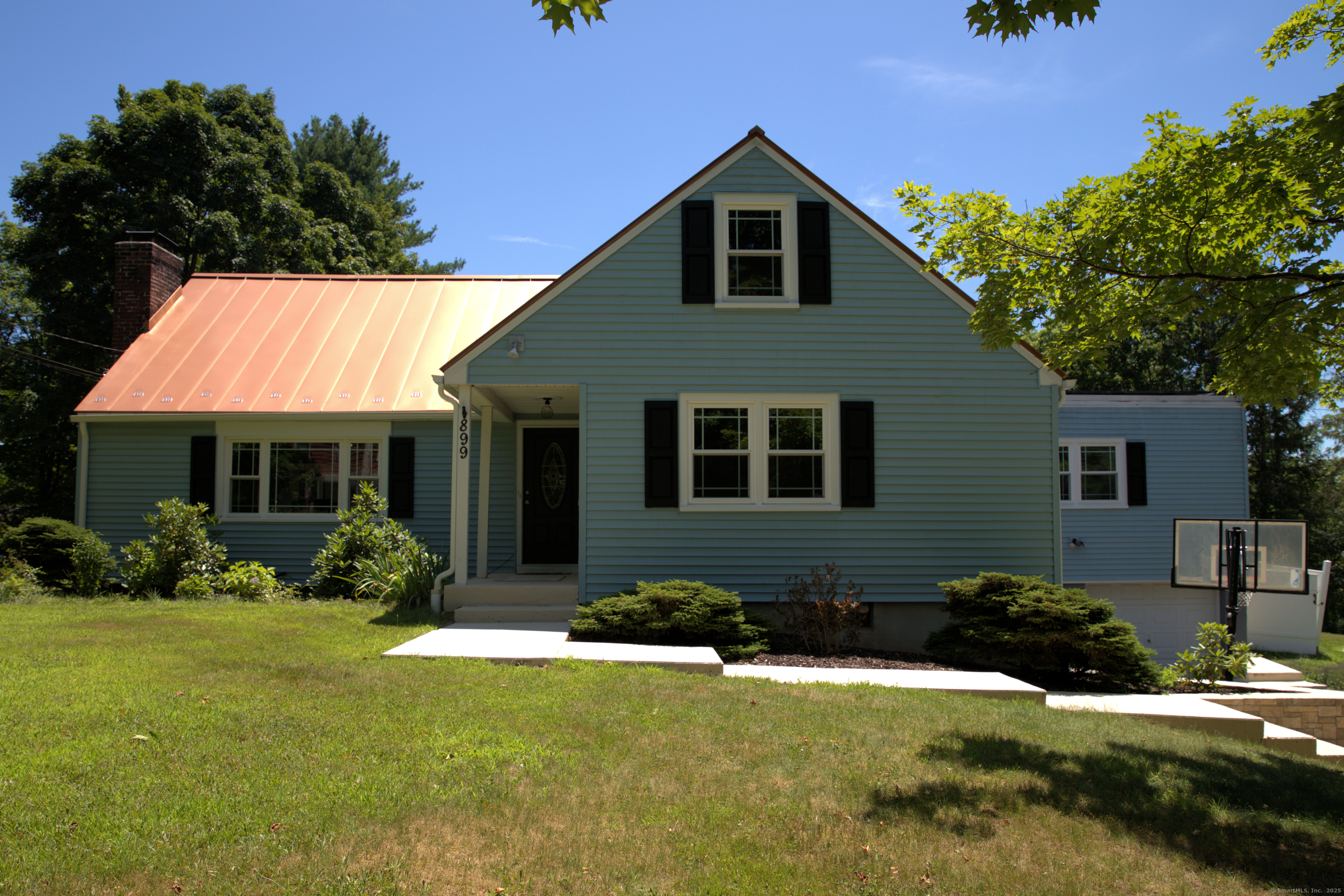 a front view of a house with yard