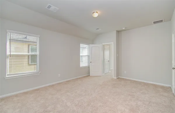 a bathroom with a granite countertop sink a toilet and a shower