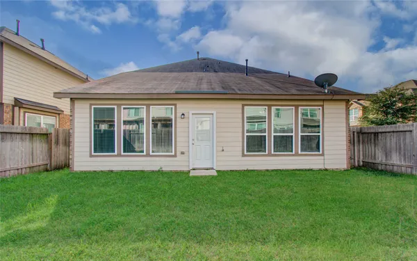 a view of front of house with a yard