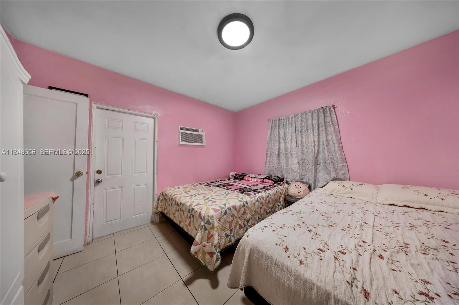 1858 Southwest 5th Street Miami, FL 33135 - Photo 11 of 23 a bedroom with two beds and a closet