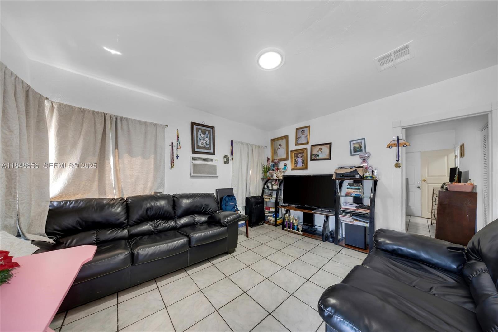 1858 Southwest 5th Street Miami, FL 33135 - Photo 13 of 23 a living room with furniture and a flat screen tv
