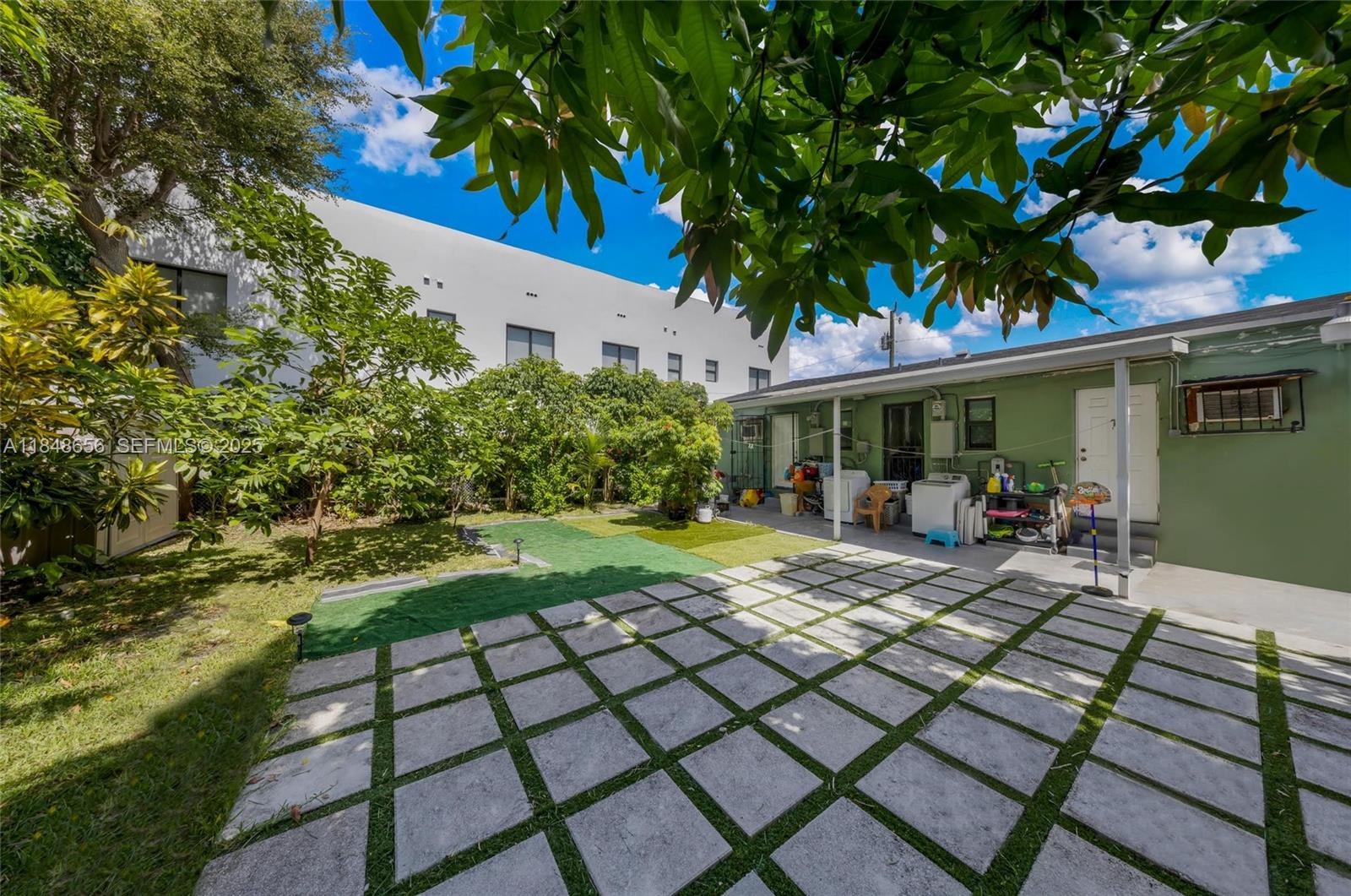 1858 Southwest 5th Street Miami, FL 33135 - Photo 19 of 23 a view of a house with backyard porch and sitting area