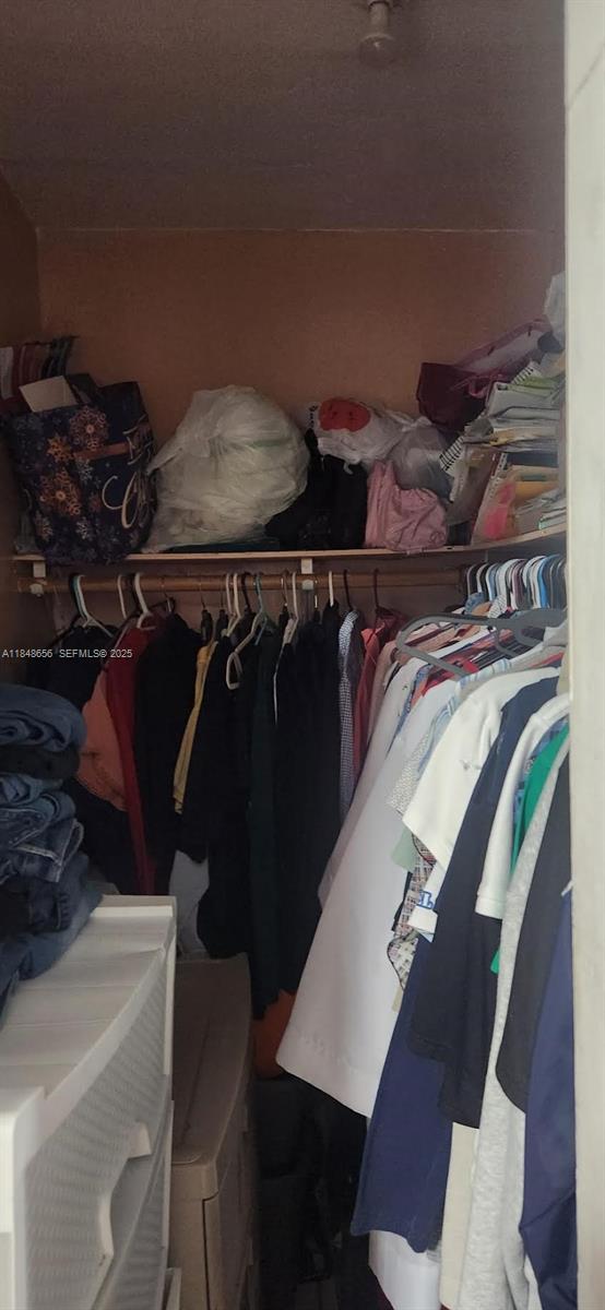 1858 Southwest 5th Street Miami, FL 33135 - Photo 21 of 23 a view of walk in closet with clothes and shoes