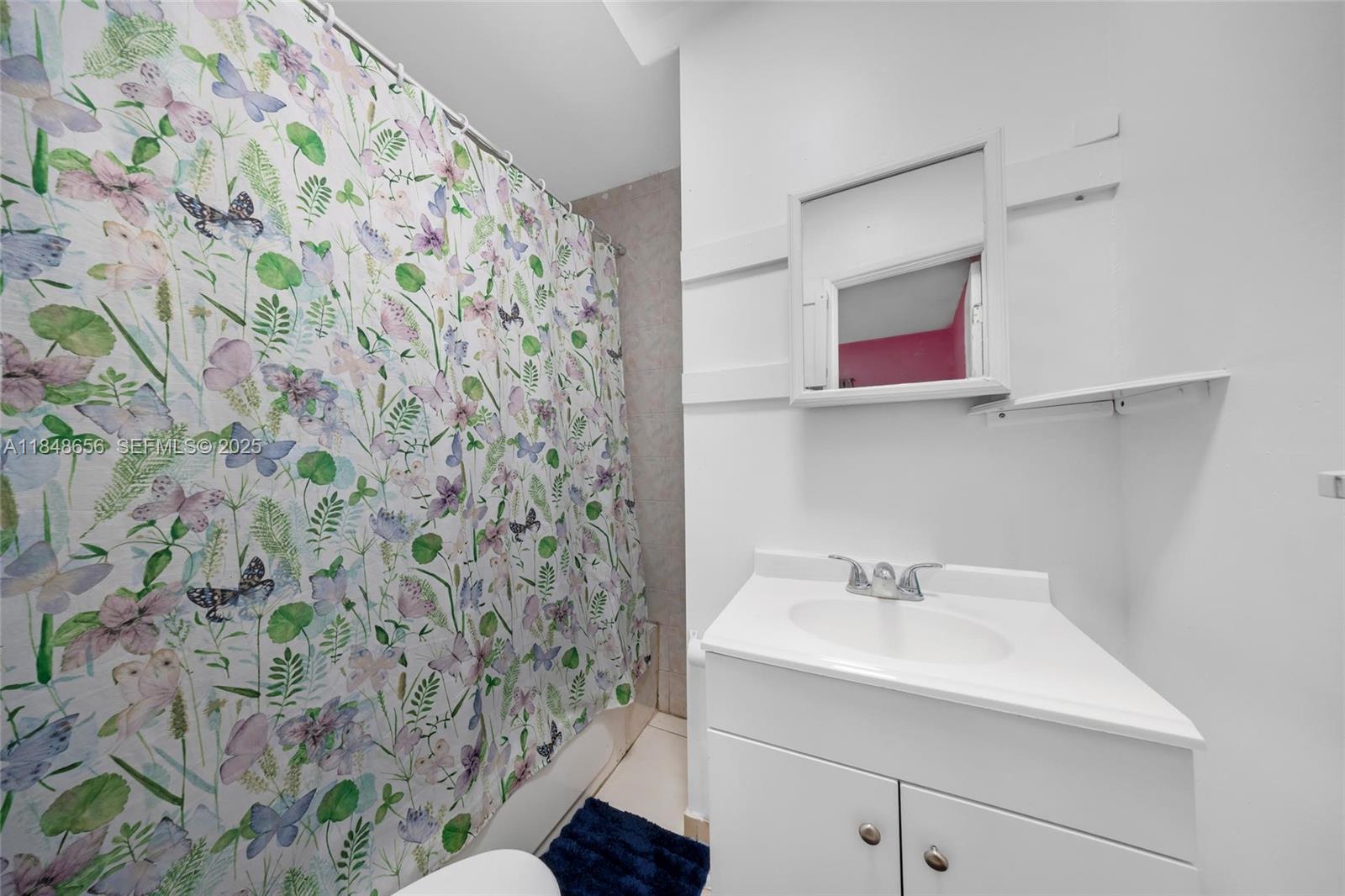 1858 Southwest 5th Street Miami, FL 33135 - Photo 10 of 23 a bathroom with a sink and a mirror