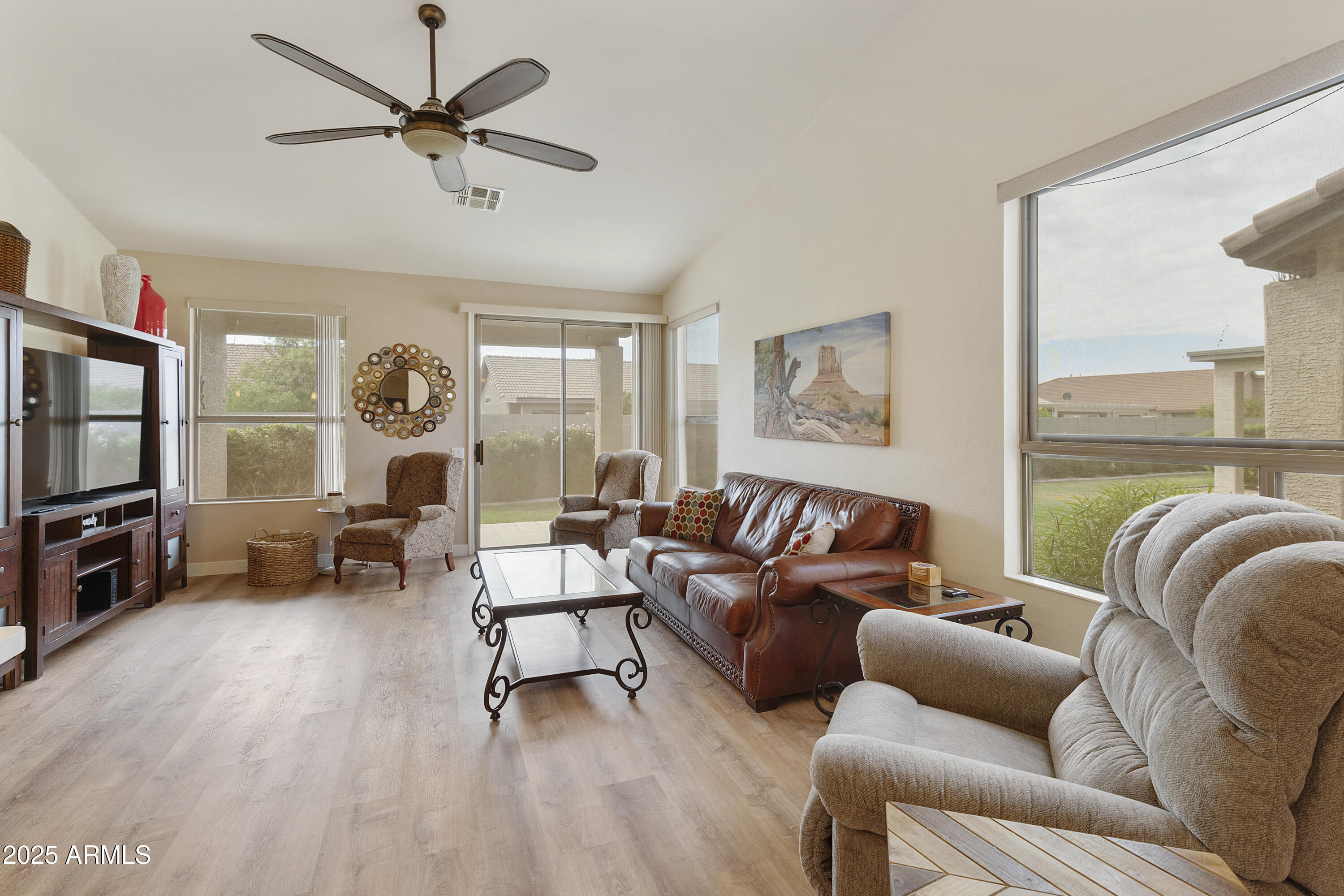 23745 South Vacation Way Sun Lakes, AZ 85248 - Photo 6 of 52 a living room with furniture and a flat screen tv