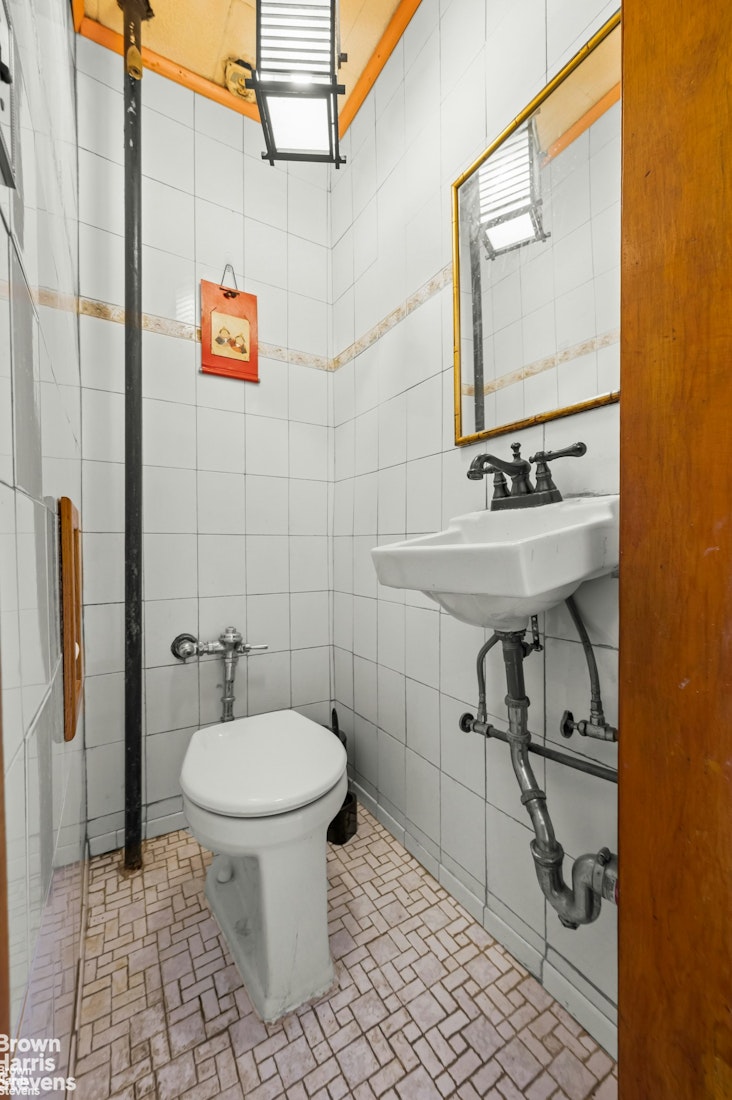2954 Avenue R Brooklyn, NY 11229 - Photo 11 of 37 a bathroom with a sink a toilet and shower