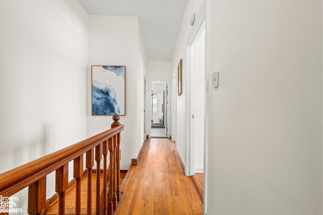 2954 Avenue R Brooklyn, NY 11229 - Photo 17 of 37 a view of a hallway with wooden floor and a bathroom