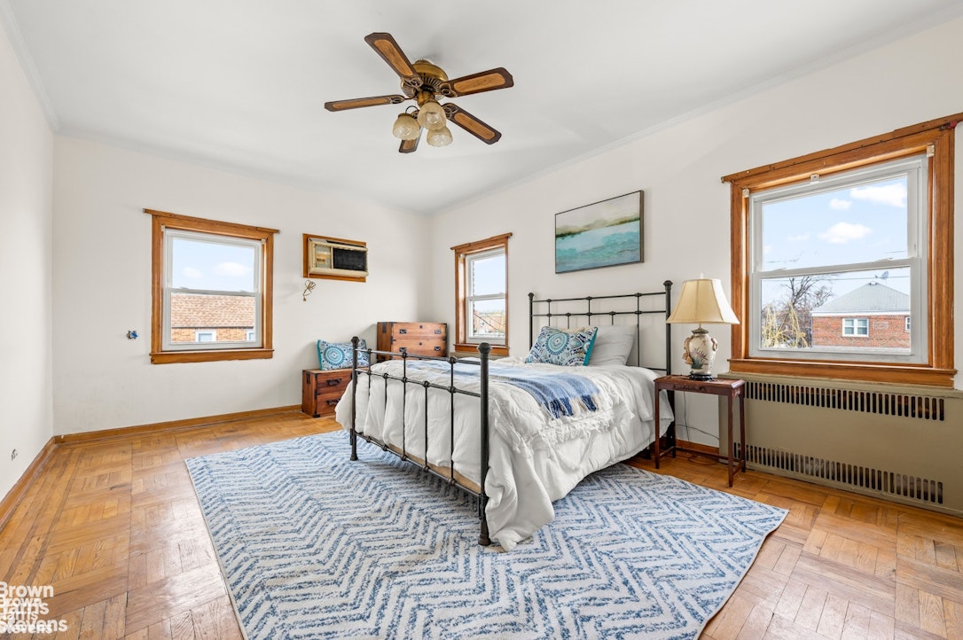 2954 Avenue R Brooklyn, NY 11229 - Photo 18 of 37 a bedroom with a large bed and a window
