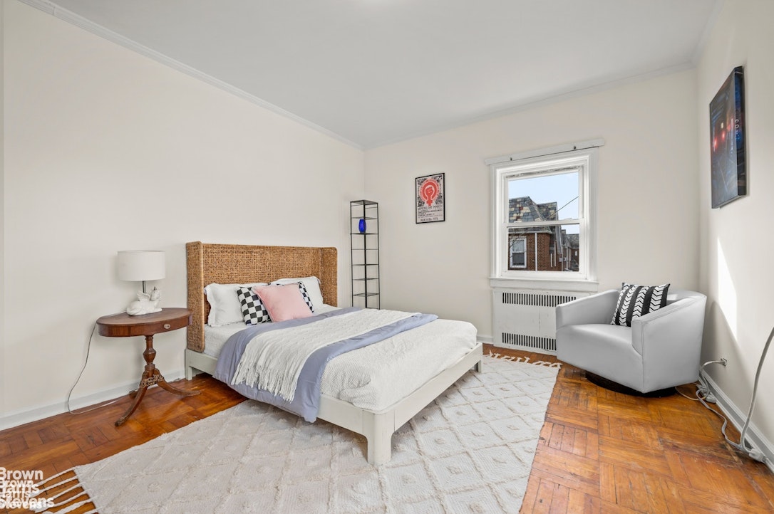 2954 Avenue R Brooklyn, NY 11229 - Photo 21 of 37 a bedroom with a bed couch and a window