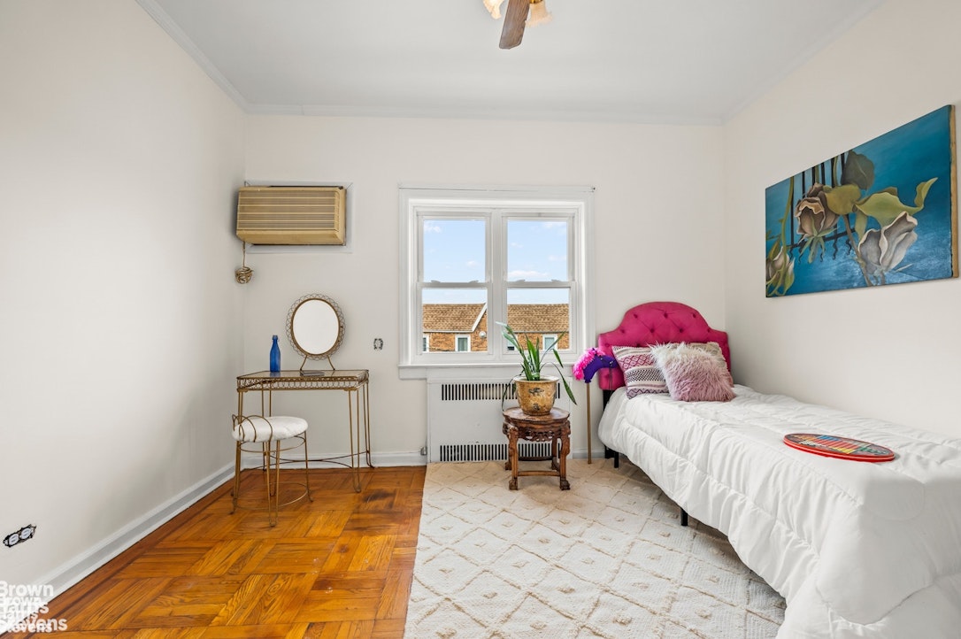 2954 Avenue R Brooklyn, NY 11229 - Photo 24 of 37 a bedroom with a bed and a table in it