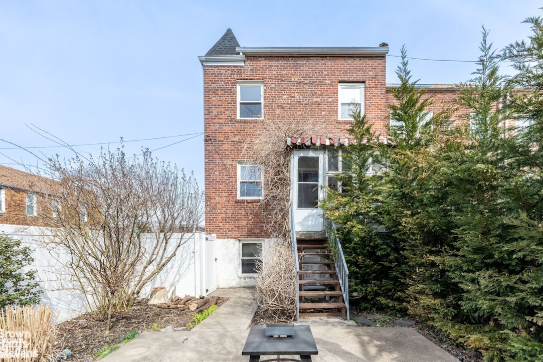 2954 Avenue R Brooklyn, NY 11229 - Photo 29 of 37 a front view of a house with a yard