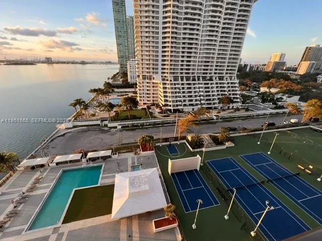 a view of roof deck with wooden floor and lake view