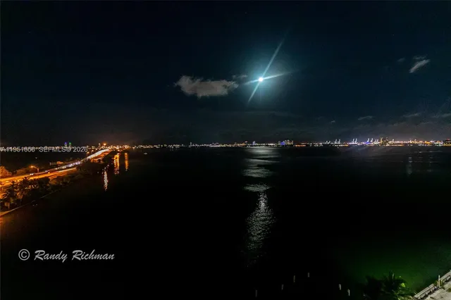 a sunset view with a lake