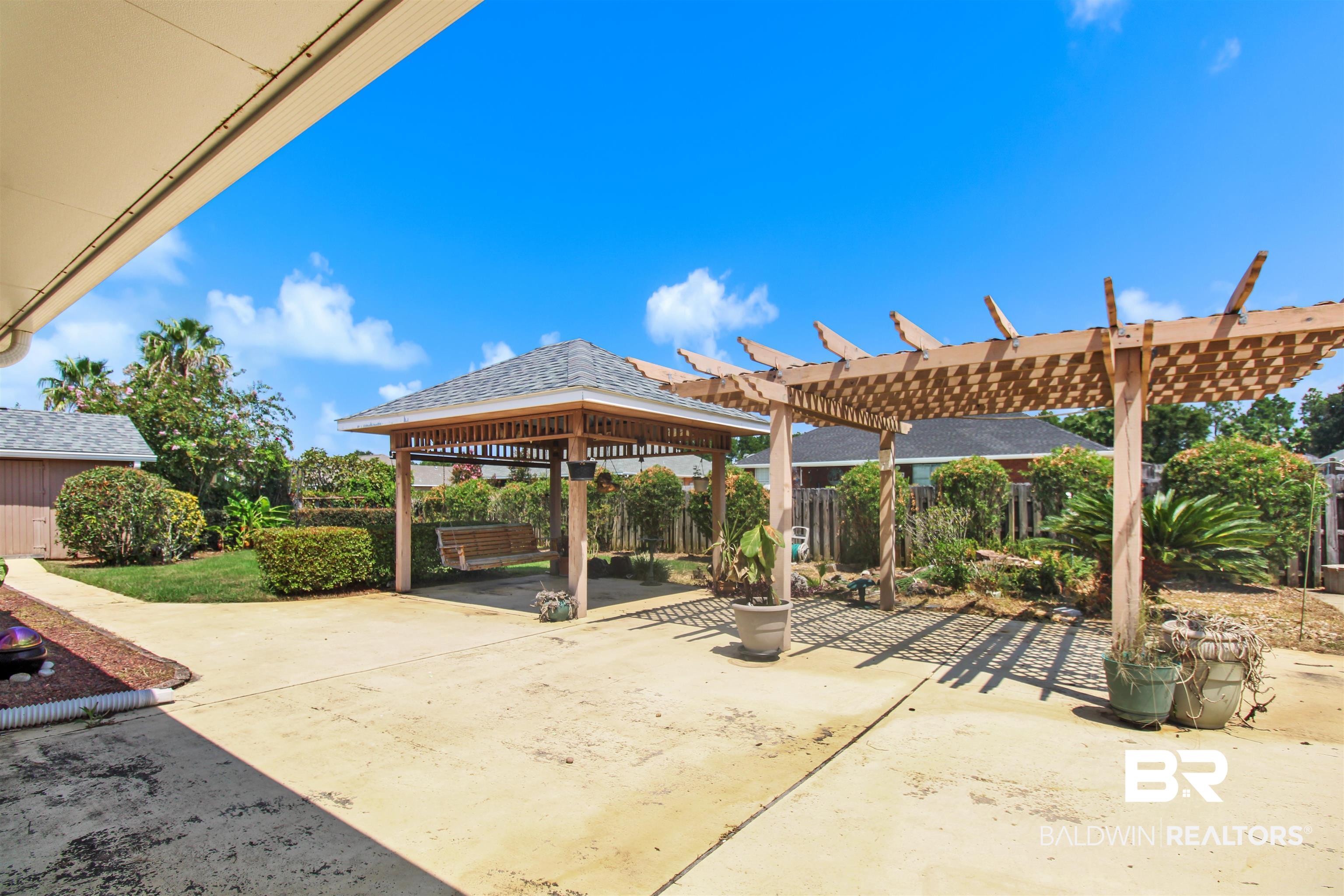 412 Collinwood Loop Foley, AL 36535 - Photo 3 of 23 View of patio with a pergola and a gazebo