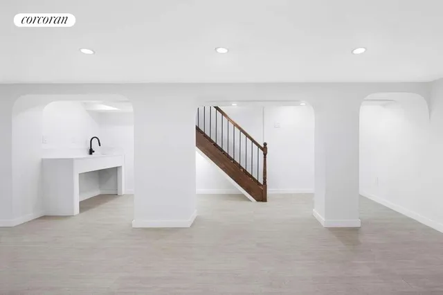 an empty room with windows and closet