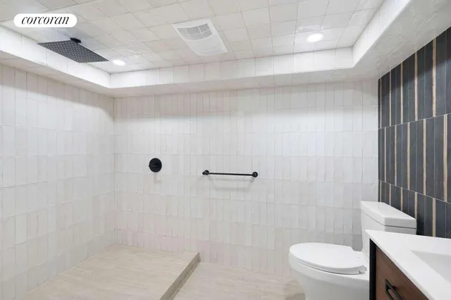 a view of an empty room with a fireplace