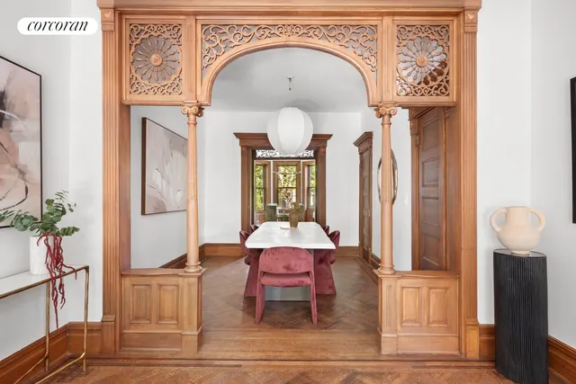 a living room with furniture and large windows